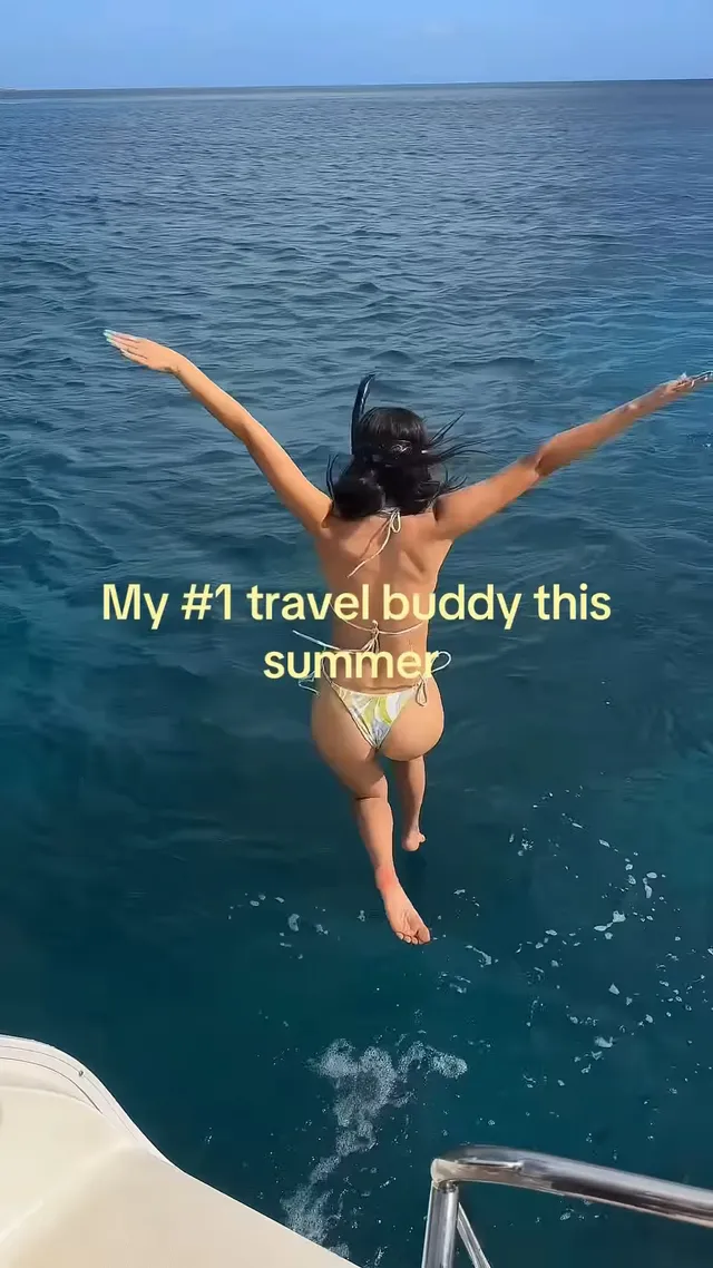 Victoria Justice jumping barefoot from a boat into the sea.