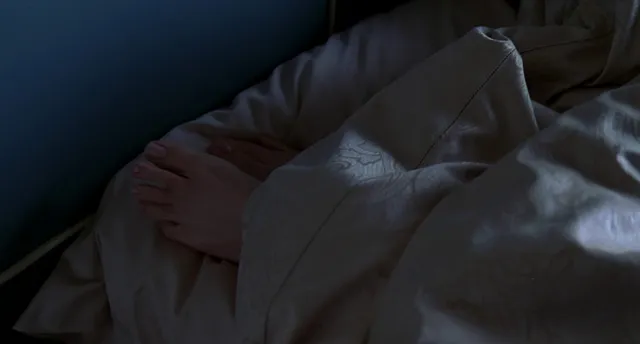 Jennifer Garner a close-up of bare feet resting during a screen scene.