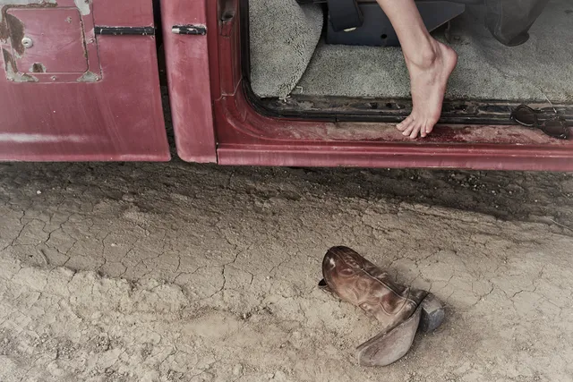 Kate Bosworth stepping from a vehicle in a screen scene.