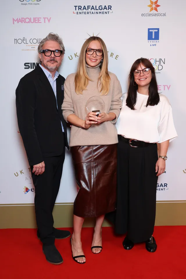 Jodie Comer standing with two guests at a theatre event.