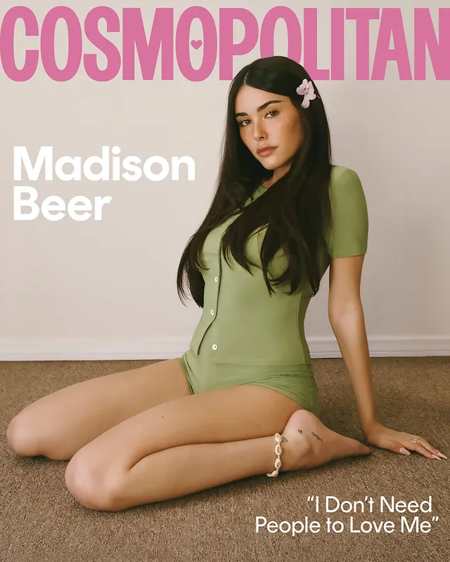 Madison Beer kneeling for a magazine cover portrait.