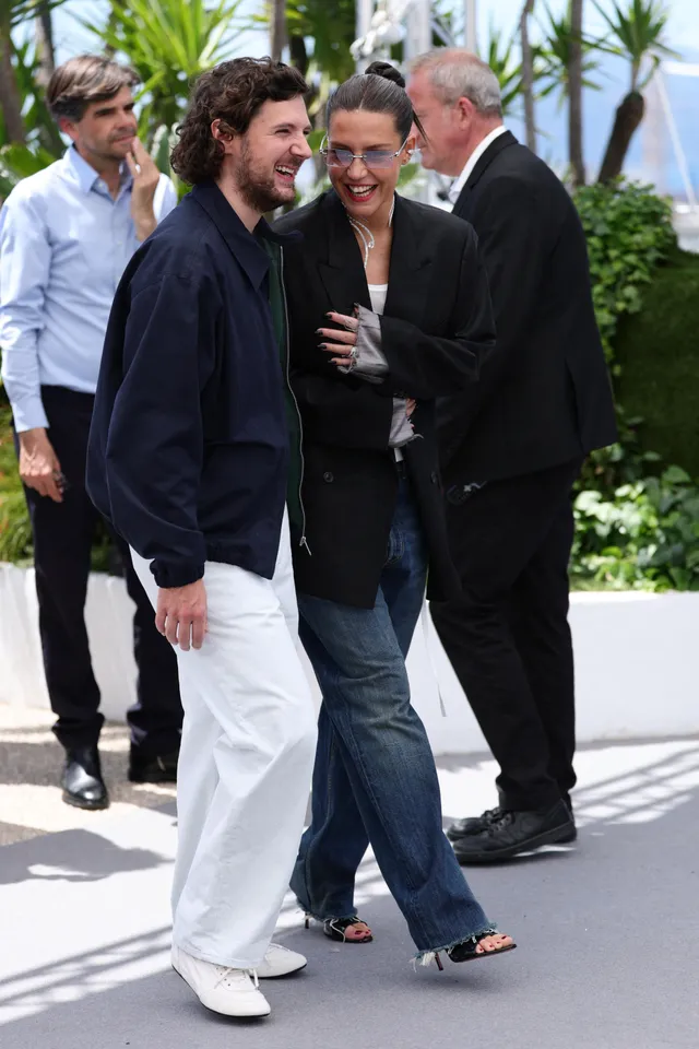 Adèle Exarchopoulos walking beside a man at a festival.