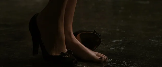Kate Bosworth stepping from a pump in a screen scene.