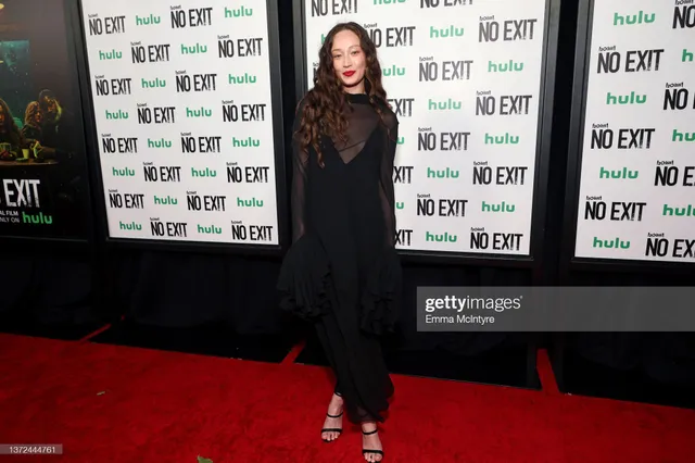 Havana Rose Liu wearing a black gown and heels at an event.