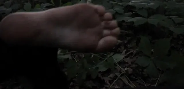 Victoria Pedretti a close-up of bare feet during a screen scene.