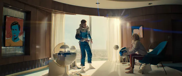 Vanessa Kirby a screen scene standing in a bright room.
