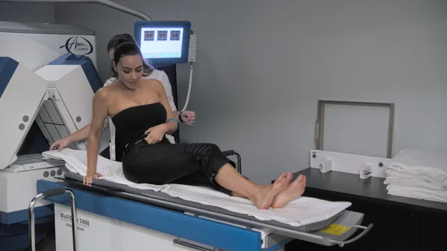 Kim Kardashian: reclining barefoot on a treatment bed.