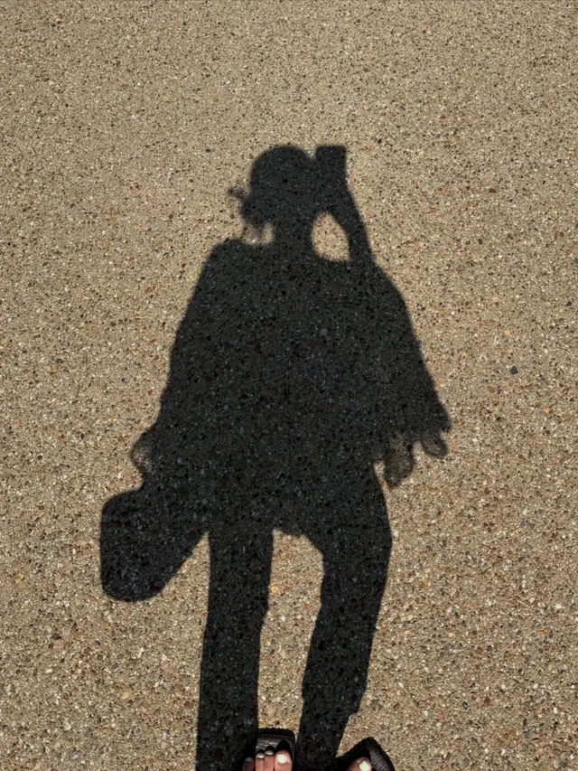 Lisa (Lalisa Manobal) showing her shadow on an outdoor path.