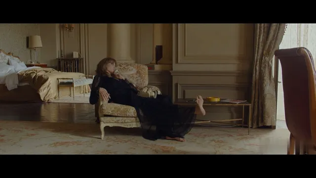 Angelina Jolie a reclining screen scene on a chair.