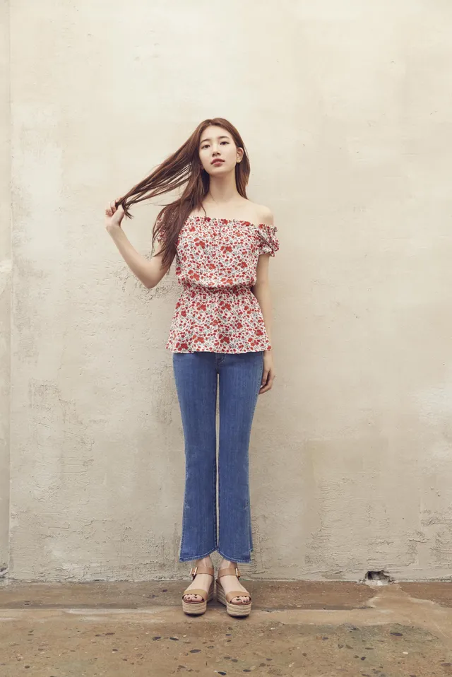 Bae Suzy wearing a floral top and pale platform heels.