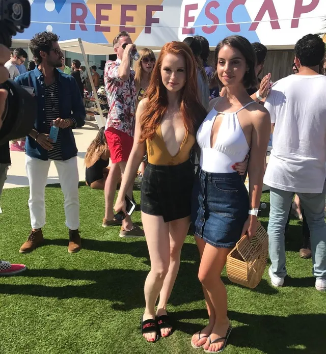 Adelaide Kane standing with a companion at an outdoor event.