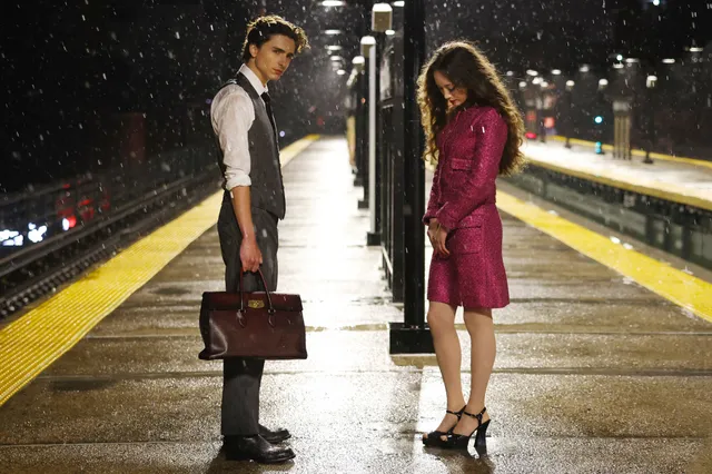 Havana Rose Liu posing on a train platform in black heels.