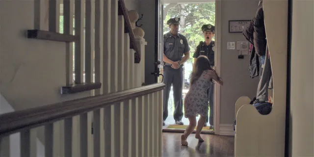 Anna Kendrick appearing in a scene near an open doorway.