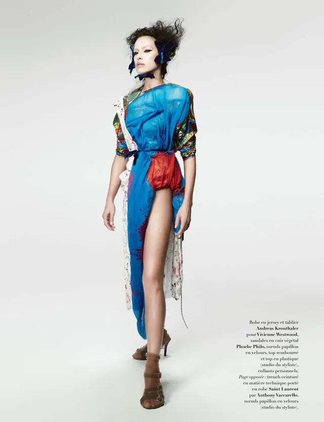 Irina Shayk a colourful fashion outfit with ankle-strap heels.