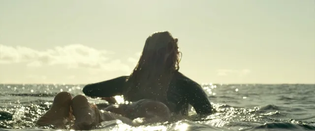 Blake Lively swimming in a screen scene.