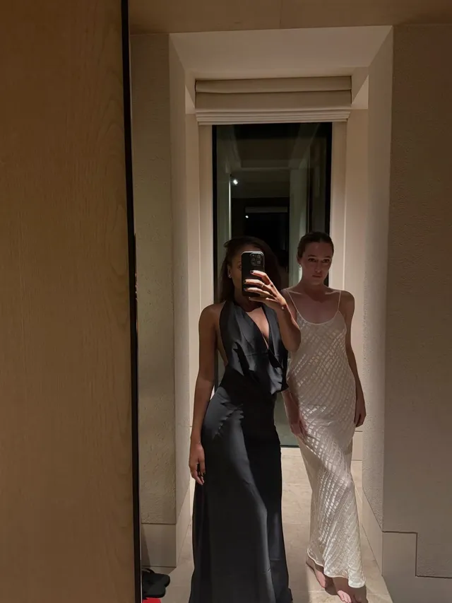 Alycia Debnam-Carey taking a mirror portrait beside a companion.
