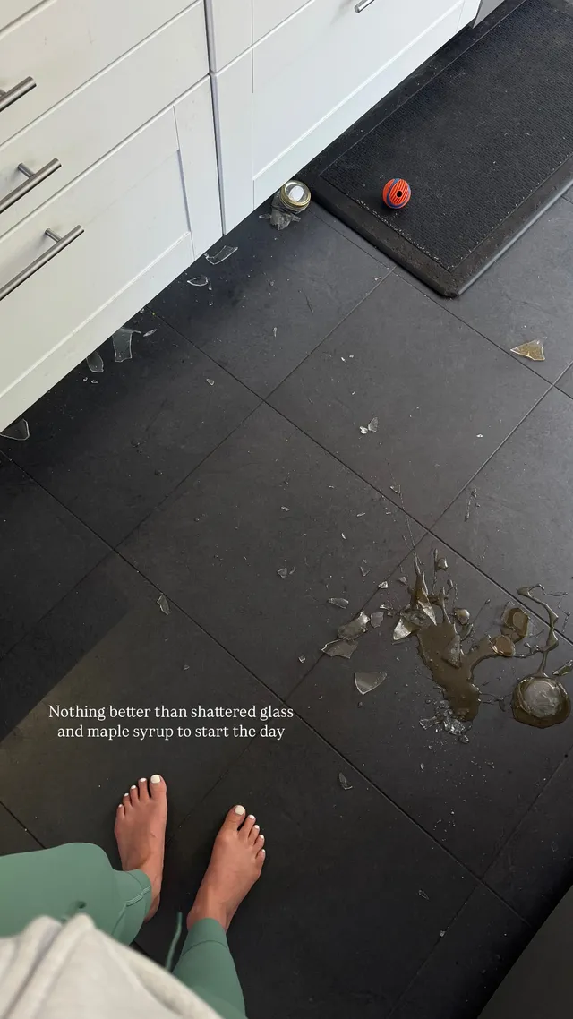 Sophie Nélisse standing barefoot in a kitchen near broken glass.