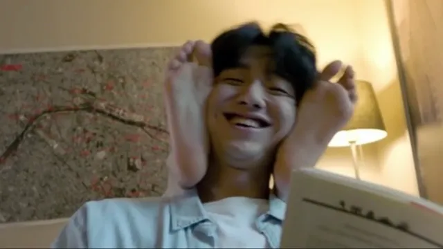 Bae Suzy raising her bare feet in a scene.