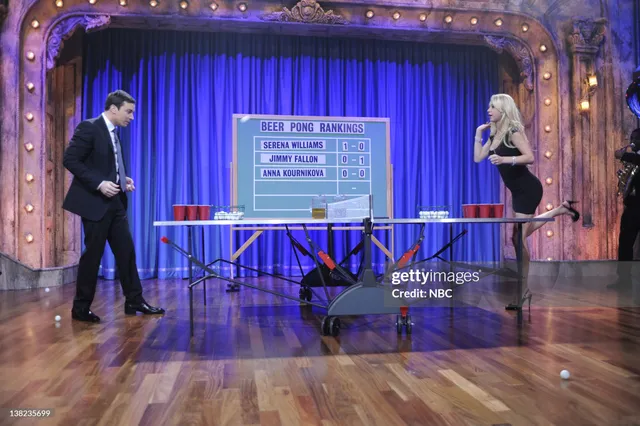 Anna Kournikova wearing heels while playing table tennis during a television appearance.
