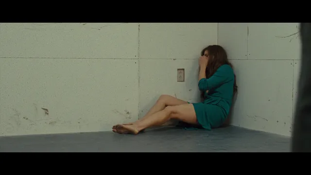 Amy Adams sitting on the floor during a screen scene.
