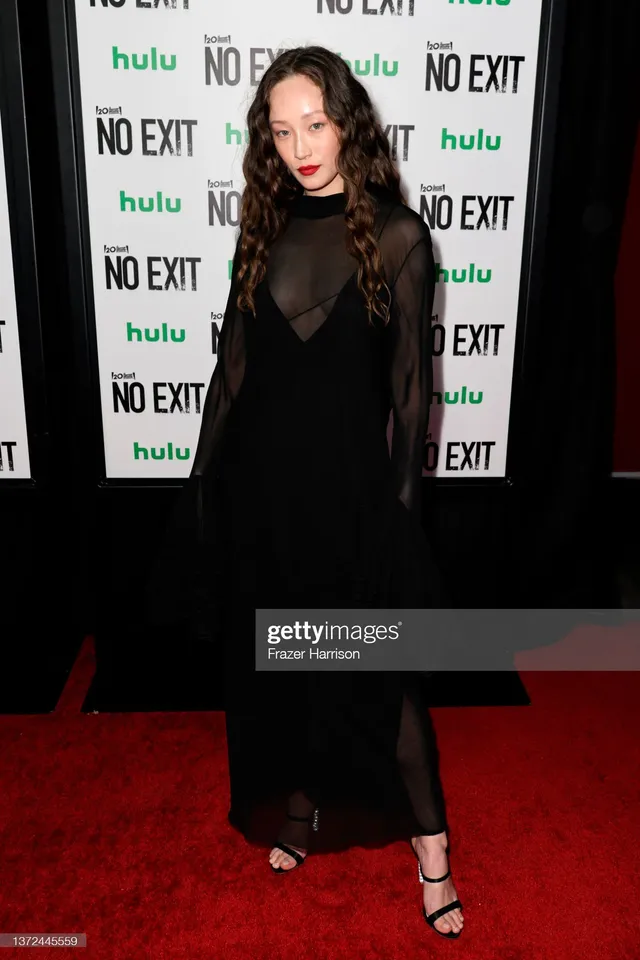 Havana Rose Liu wearing a black gown and black heels at a premiere.