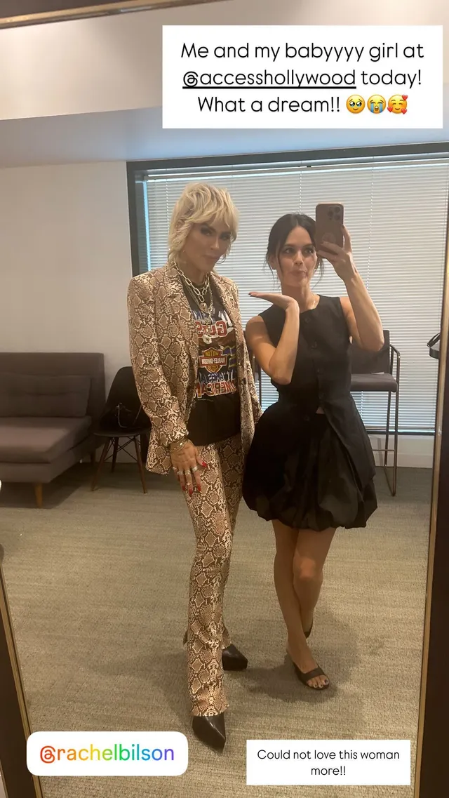 Rachel Bilson standing beside a companion for a mirror portrait.
