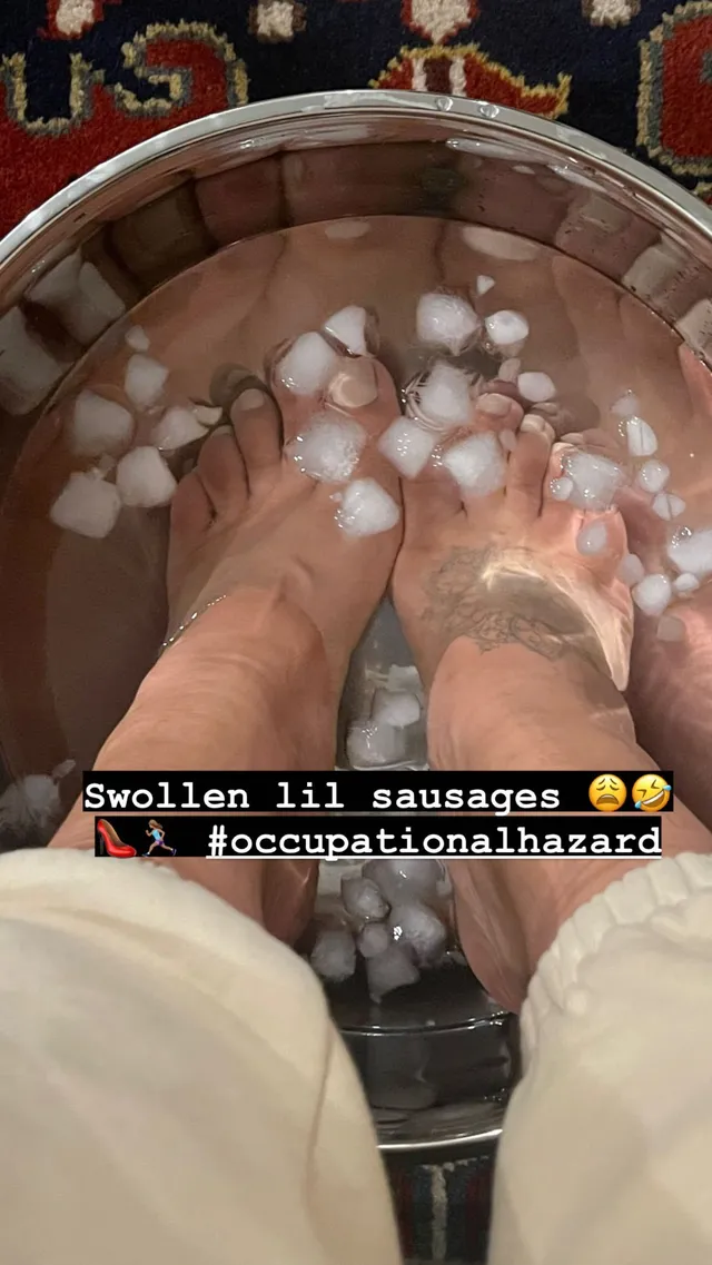 Nathalie Emmanuel soaking her feet in a bowl of ice.