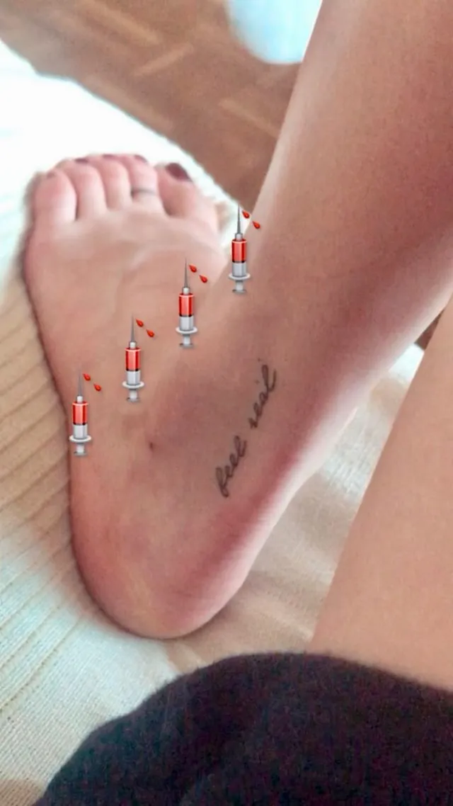 María Pedraza shown in a close-up of a bare foot with an ankle tattoo.