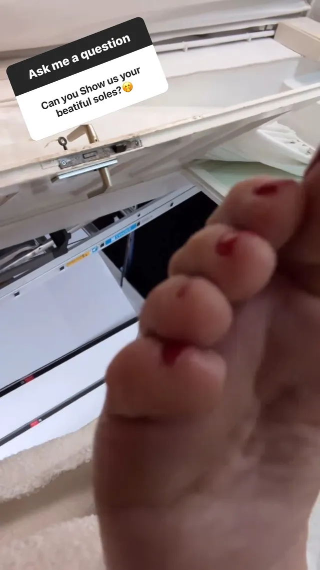 Heidi Klum showing the underside of her bare foot in close-up.