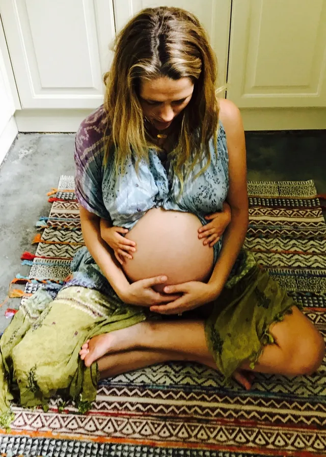 Teresa Palmer sitting cross-legged during a casual portrait.