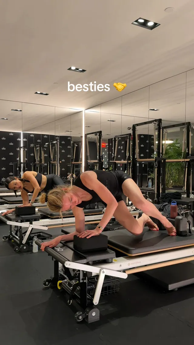 Sarah Pidgeon exercising on a Pilates machine in a gym.