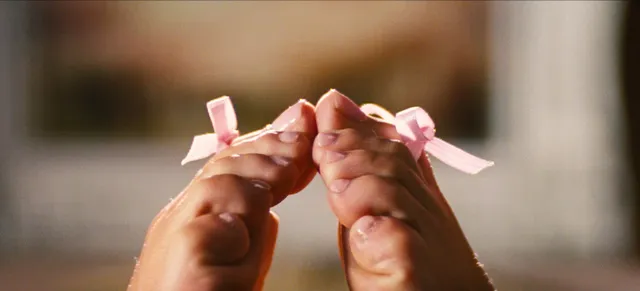 Sydney Sweeney: close view of decorated toes held together.