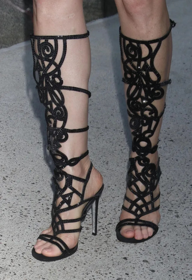 Jessica Chastain wearing black lattice sandals.