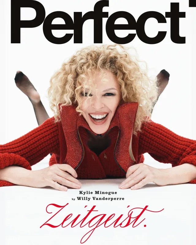 Kylie Minogue a magazine cover portrait with feet raised.