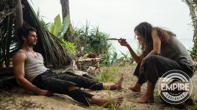 Rachel McAdams sitting beside another person on a beach in a screen image.