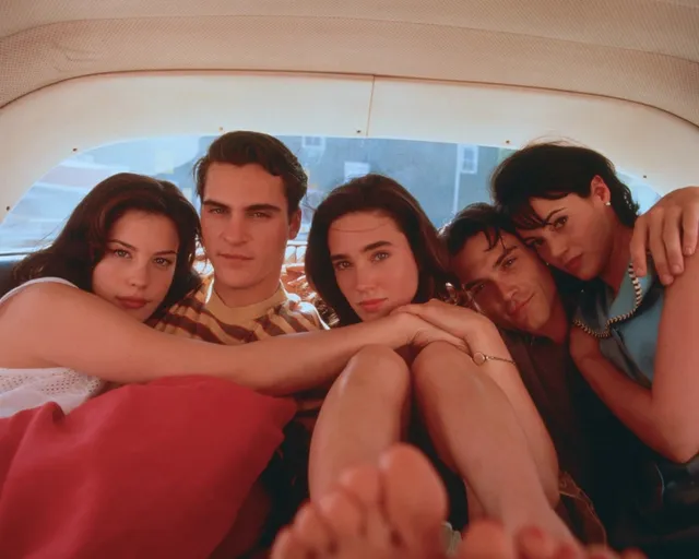 Jennifer Connelly posing with fellow performers in a casual photograph.