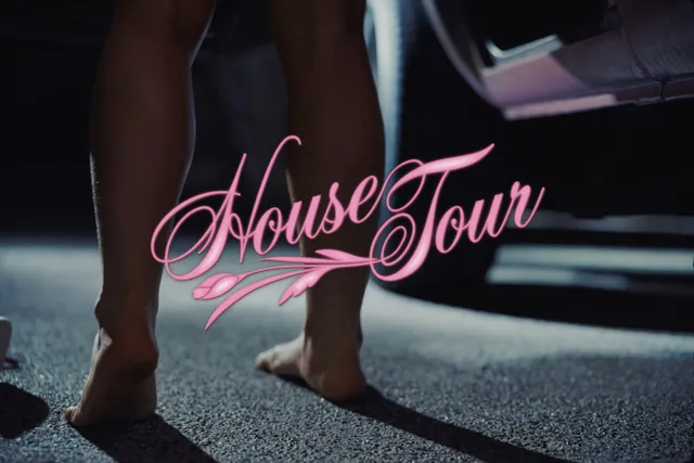 Sabrina Carpenter standing on a floor in a music video close-up.