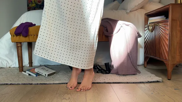 Victoria Justice standing barefoot in a patterned skirt.