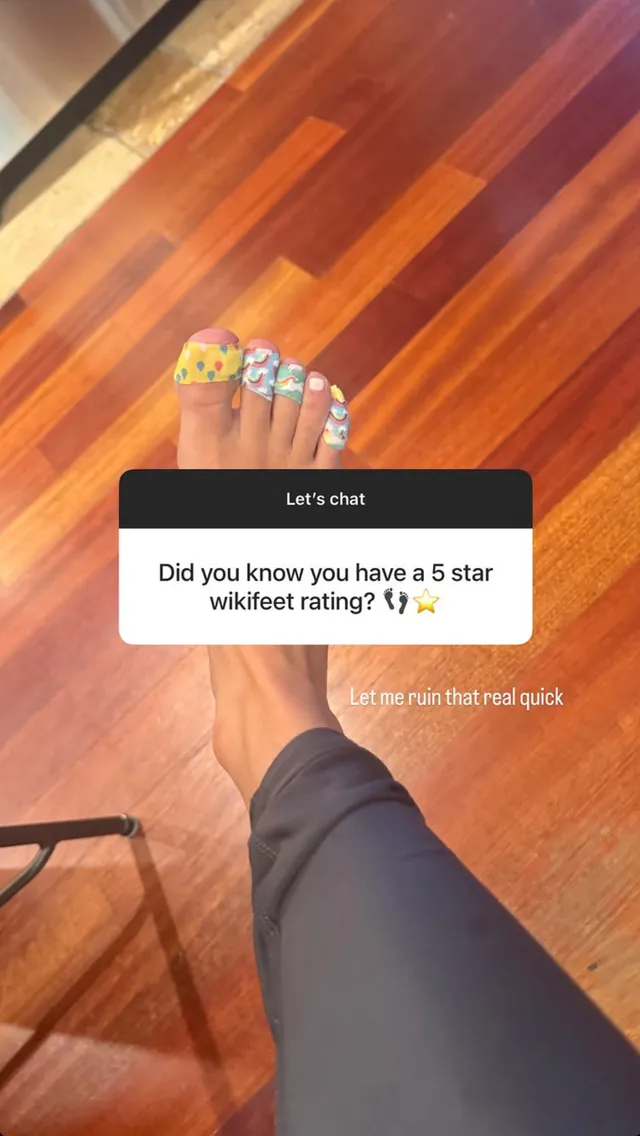 Claire Holt a close-up of colorful rings worn on toes.