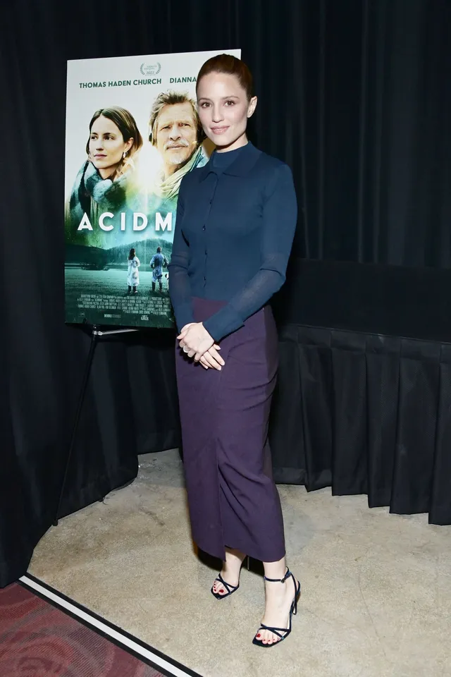 Dianna Agron posing at a film screening in ankle-strap heels.