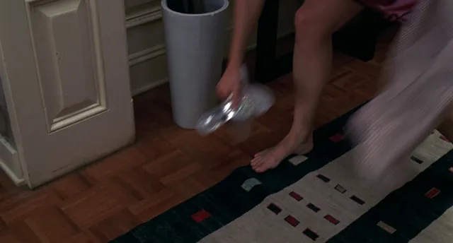 Jennifer Garner standing indoors during a screen scene.