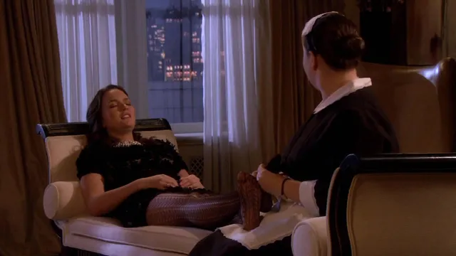 Leighton Meester resting in a chair during a screen scene.