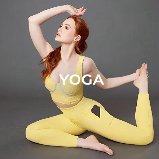 Madelaine Petsch stretching barefoot in yellow activewear.